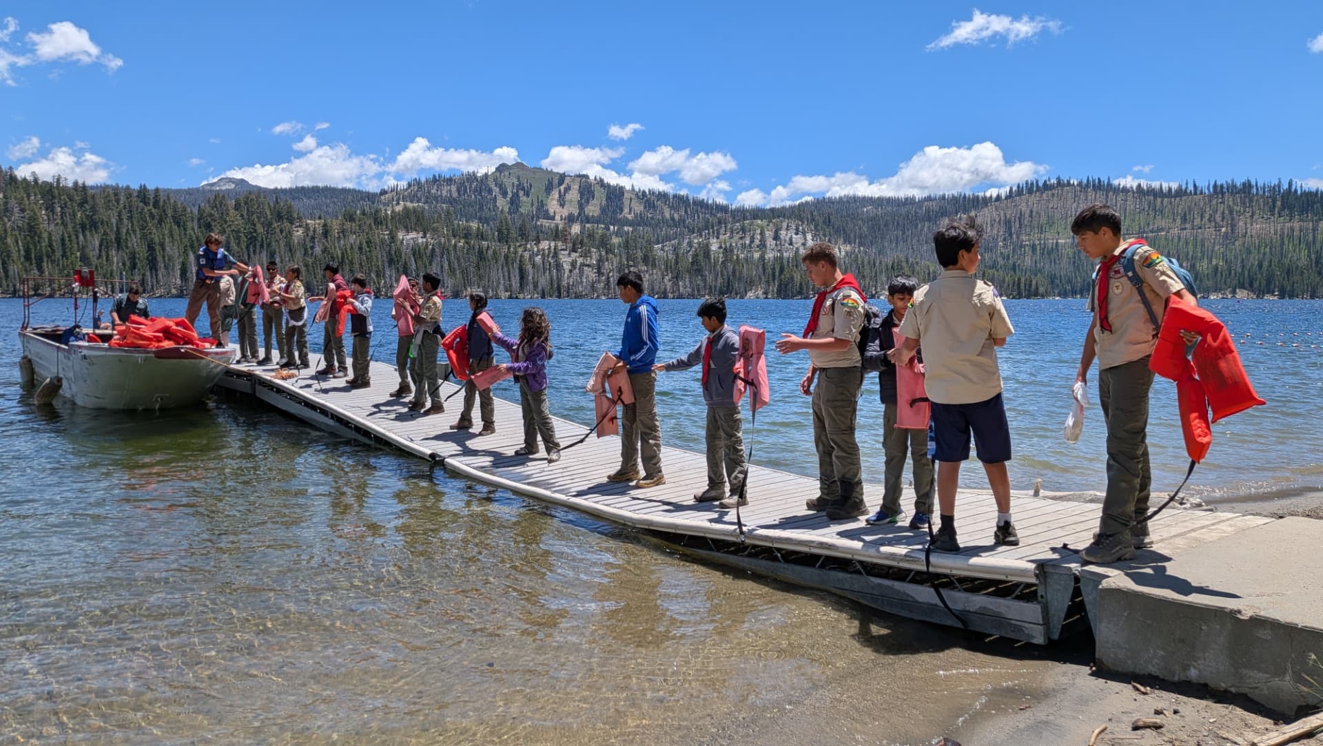 Scouts on a dock at Camp Oljato in 2026