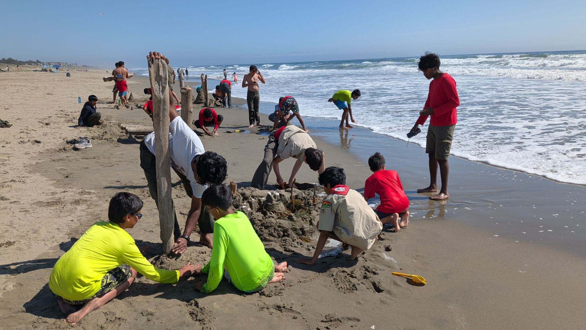 Scouts building sand sculptures on the beach at Sunset Beach in 2026